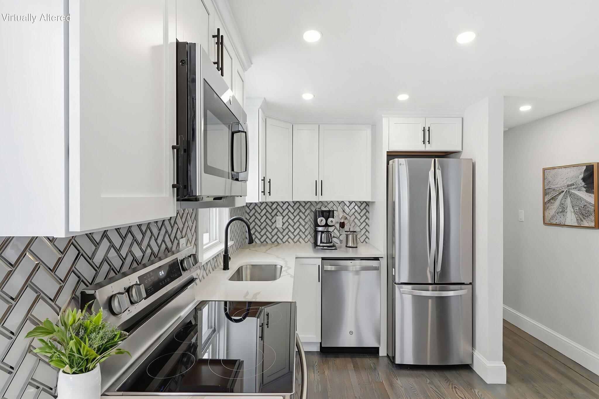 24 Hazelmoor Road South Yarmouth, MA 02664 - Photo 6 of 19 a kitchen with stainless steel appliances granite countertop a refrigerator a stove a sink and a stove