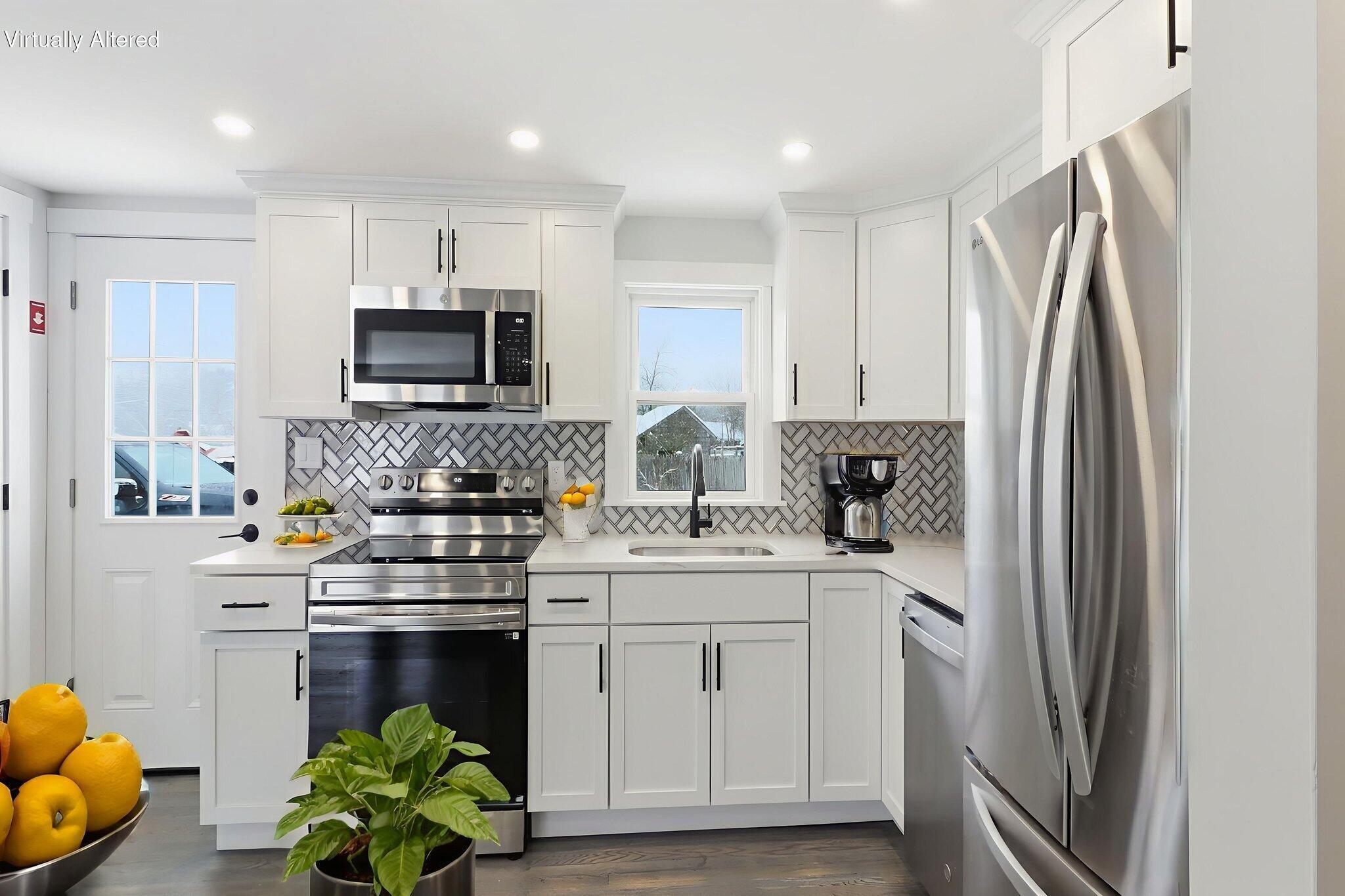 24 Hazelmoor Road South Yarmouth, MA 02664 - Photo 7 of 19 a kitchen with stainless steel appliances a stove sink and microwave