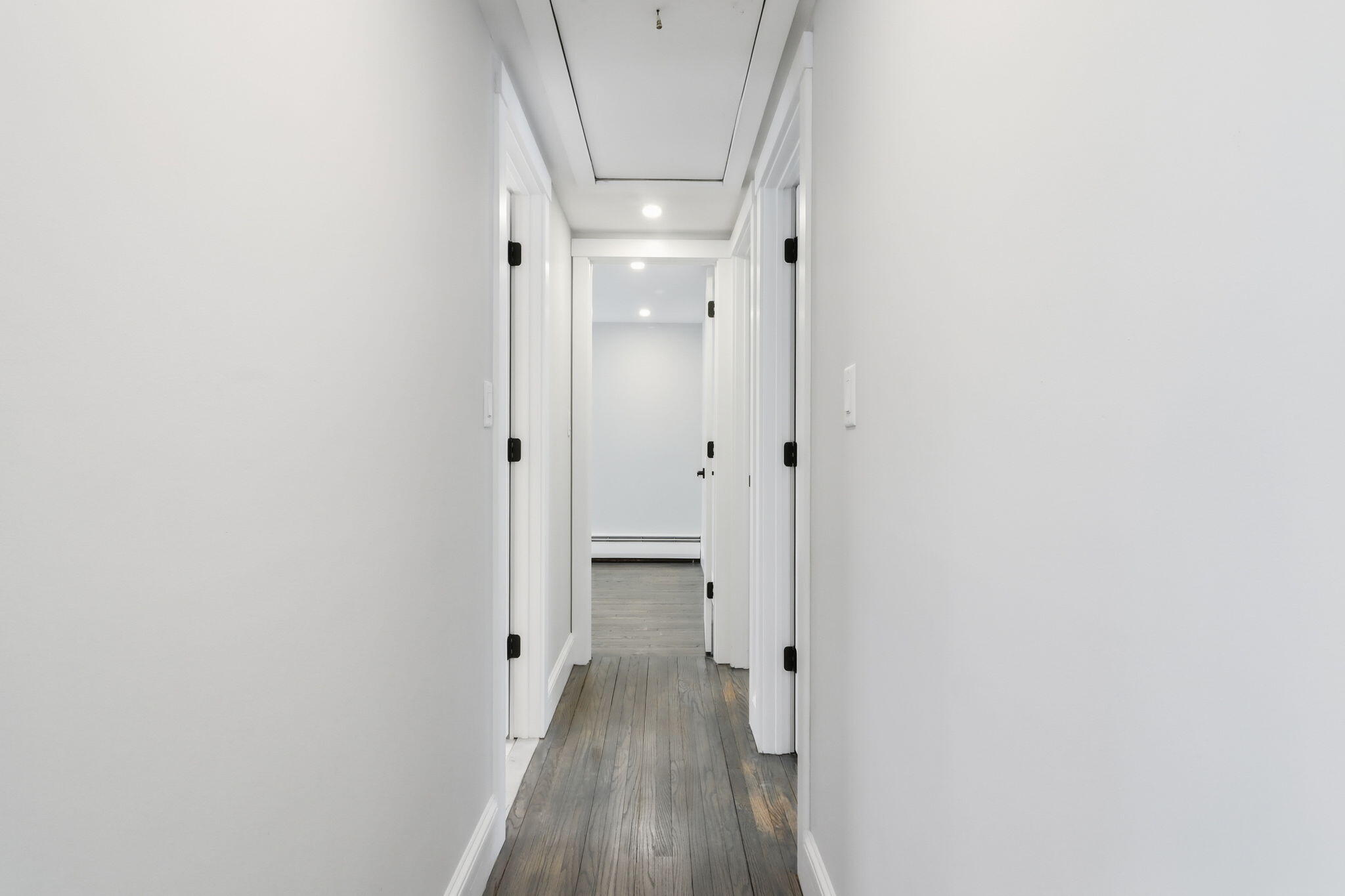 24 Hazelmoor Road South Yarmouth, MA 02664 - Photo 8 of 19 a view of a hallway with wooden floor and a bathroom