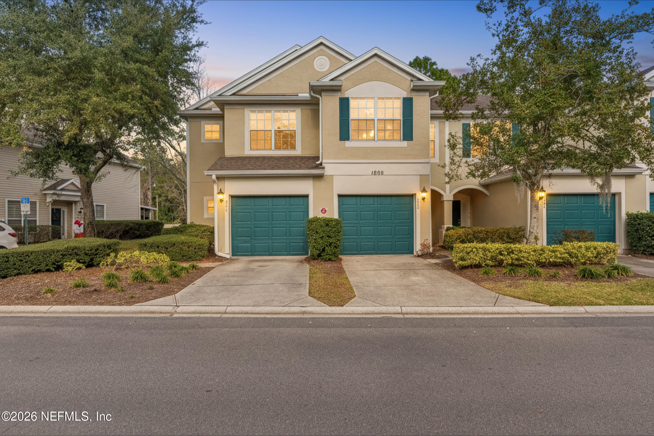 7990 Baymeadows Road, Unit 1801 Jacksonville, FL 32256 - Photo 1 of 48 a front view of a house with a yard and garage