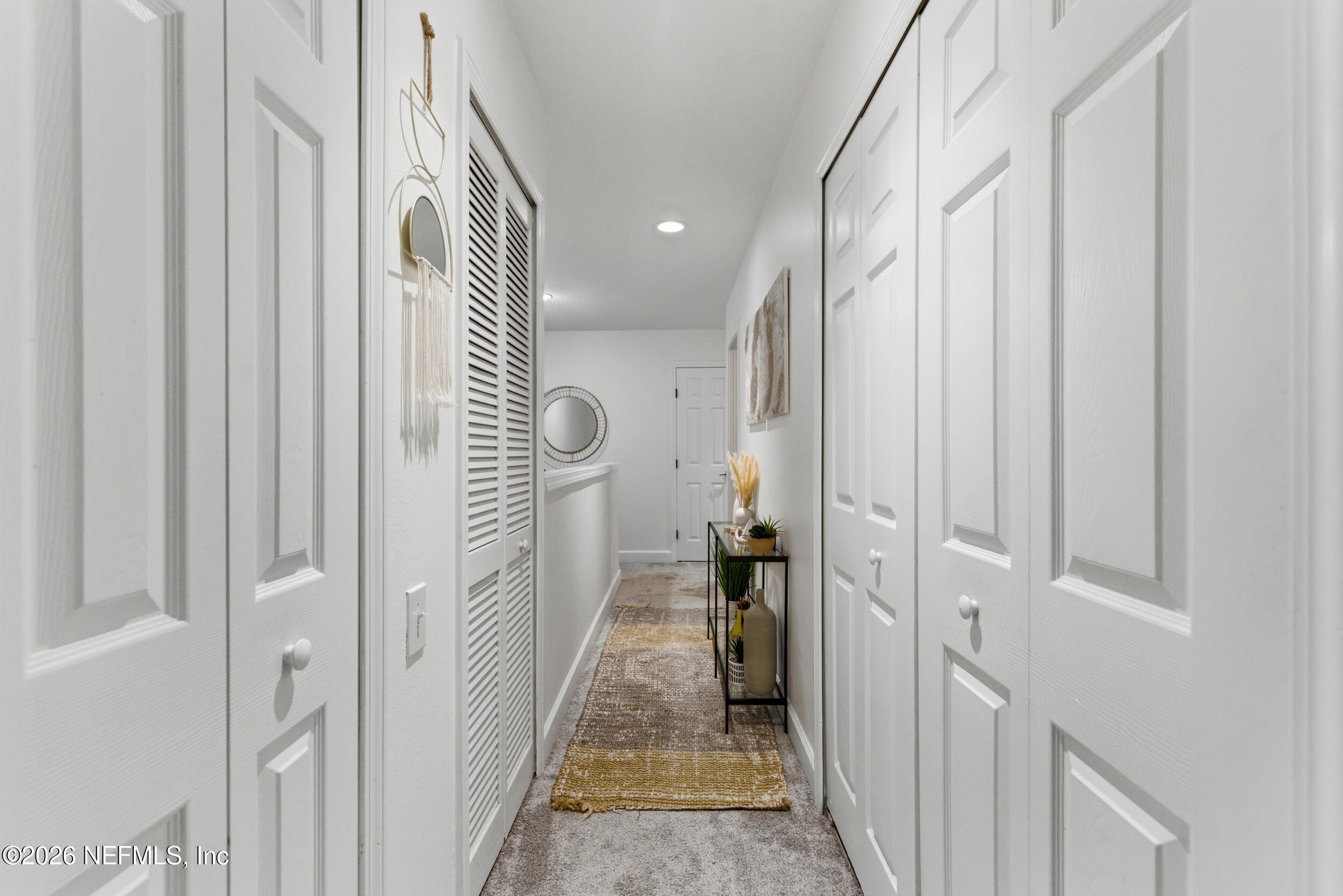 7990 Baymeadows Road, Unit 1801 Jacksonville, FL 32256 - Photo 17 of 48 a view of a hallway with a livingroom and furniture