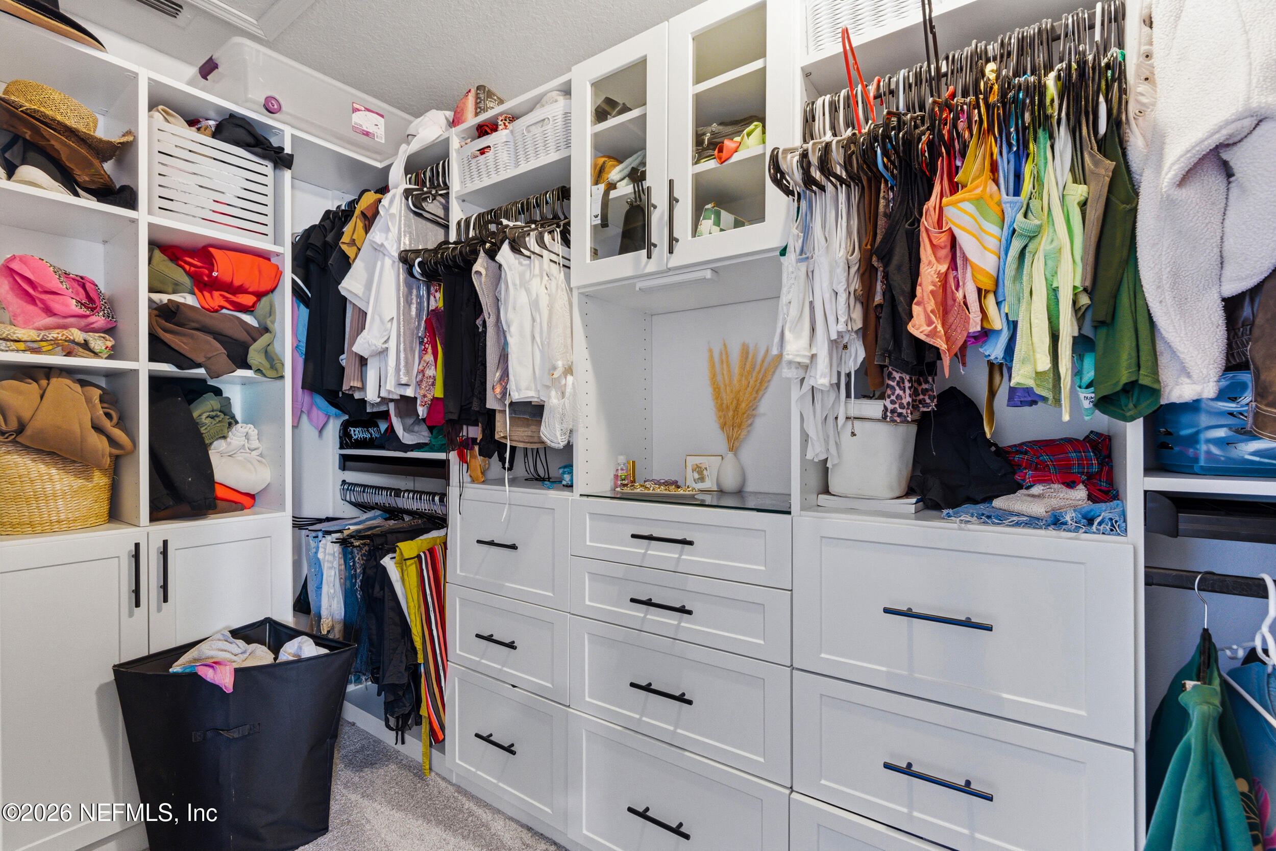 7990 Baymeadows Road, Unit 1801 Jacksonville, FL 32256 - Photo 22 of 48 a view of walk in closet with clothes and shoes