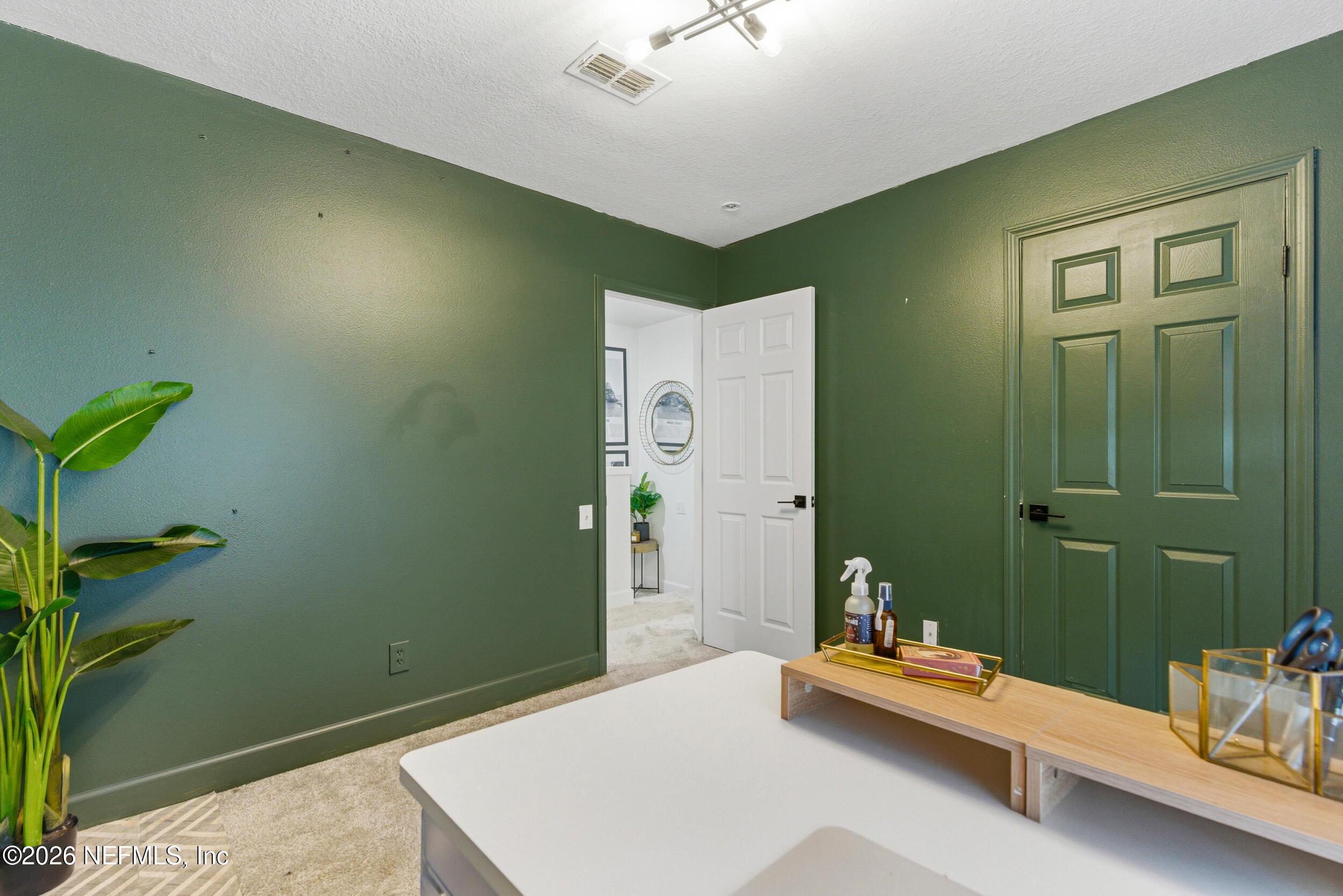 7990 Baymeadows Road, Unit 1801 Jacksonville, FL 32256 - Photo 24 of 48 a bedroom with a bed and a chandelier