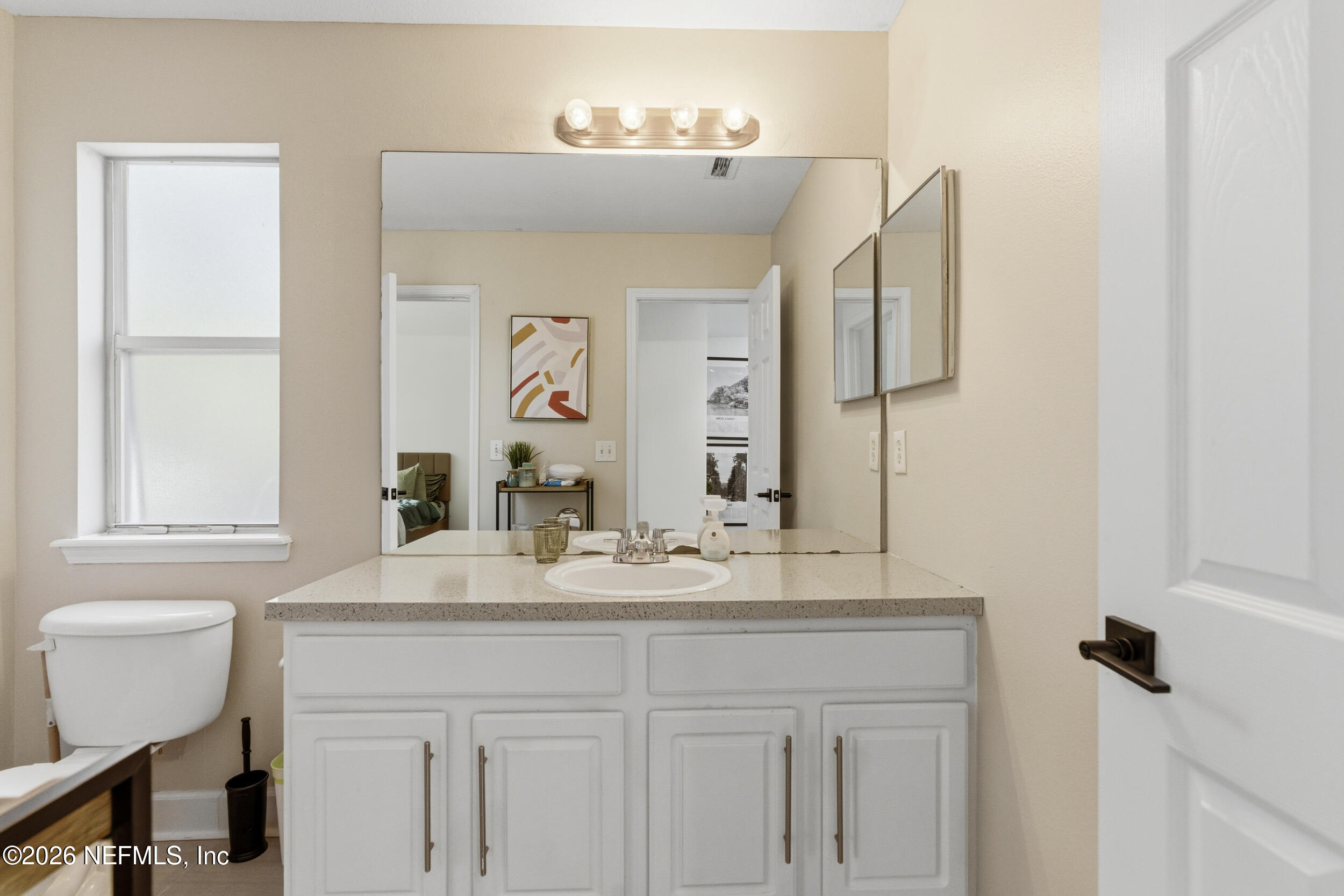 7990 Baymeadows Road, Unit 1801 Jacksonville, FL 32256 - Photo 28 of 48 a bathroom with a sink and a mirror