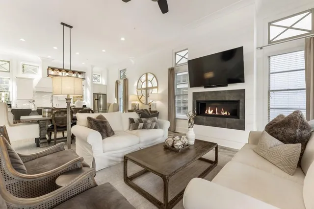 a living room with furniture and a clock