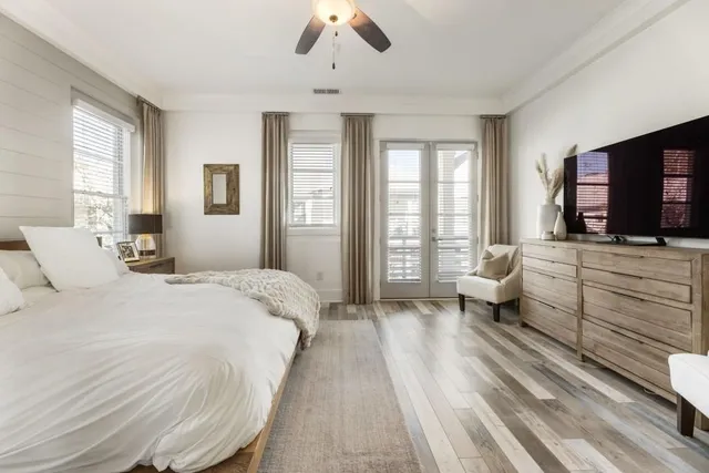 a spacious bedroom with a bed and a couch