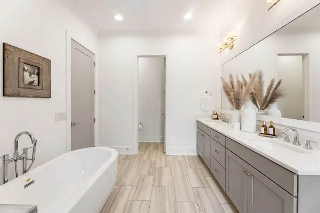 a bathroom with a bathtub and a sink