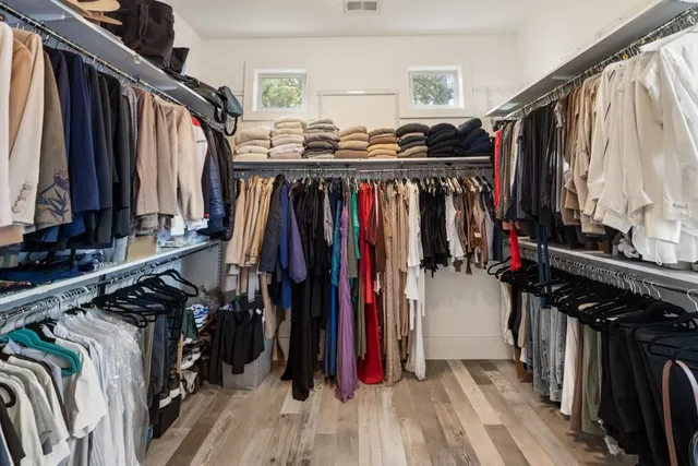 a view of a livingroom with furniture and workspace