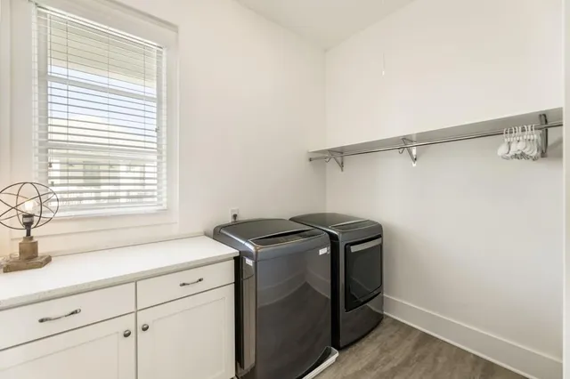 a bathroom with a sink a toilet and shower curtain