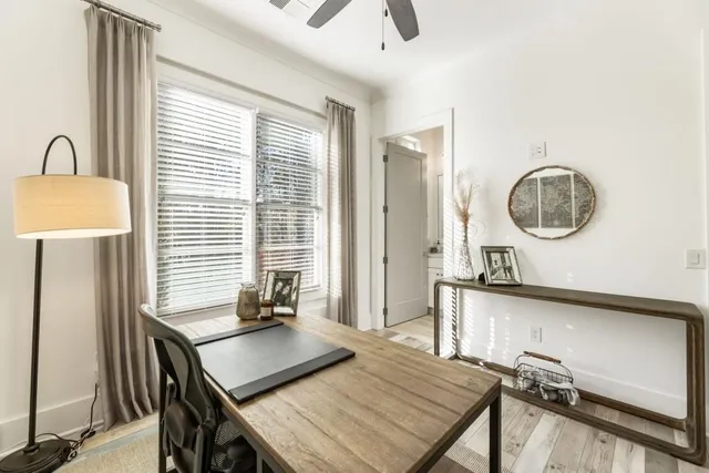 a large bed sitting in a bedroom next to a window