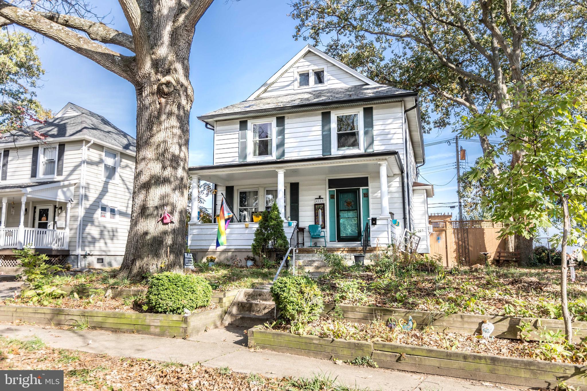 4223 Harcourt Road Baltimore, MD 21214 - Photo 2 of 36 Front yard with perennials and a majestic oak tree