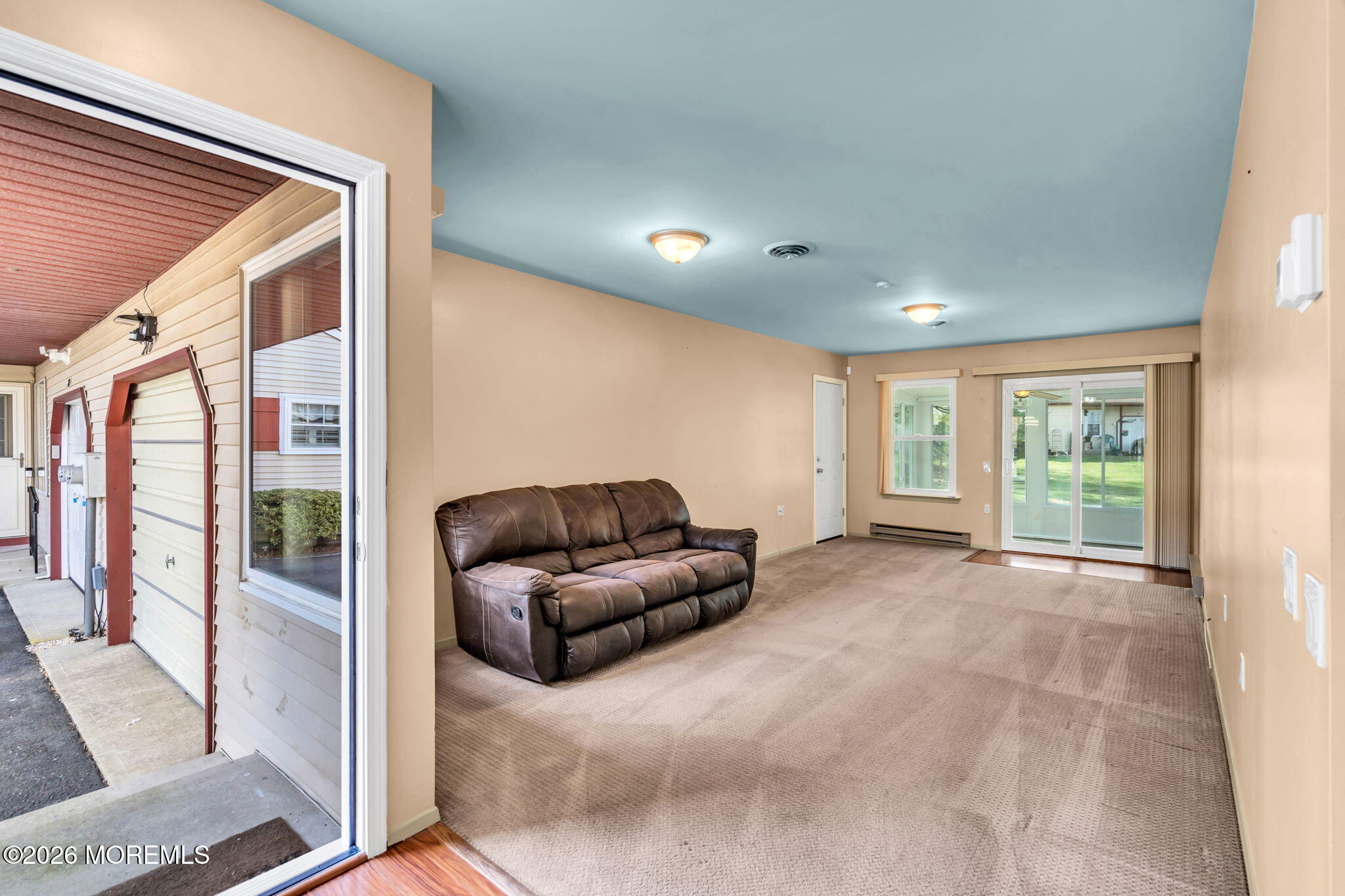 20B Amesbury Road, Unit B Whiting, NJ 08759 - Photo 3 of 25 a living room with furniture and a large window
