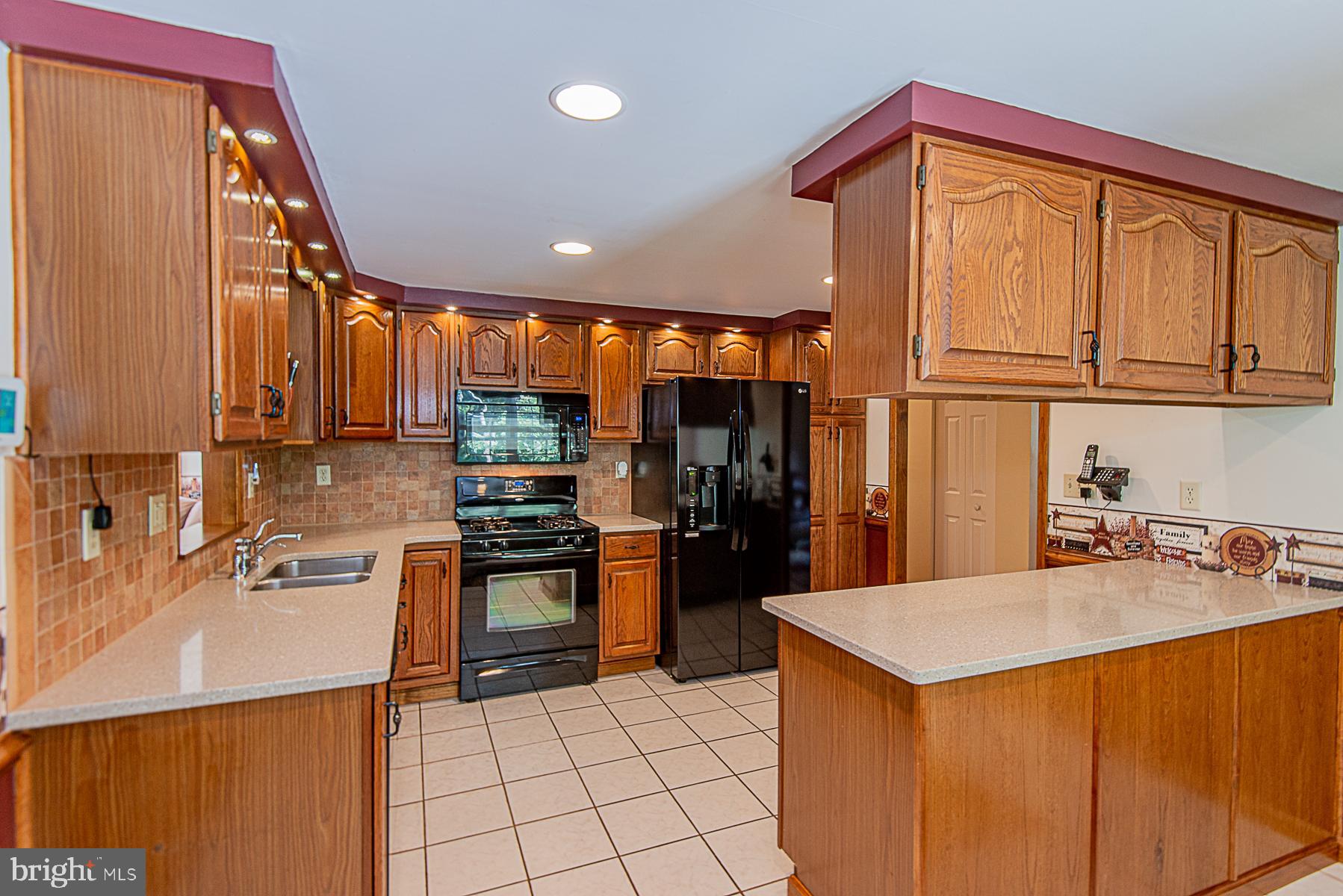 8309 Risha Drive Severn, MD 21144 - Photo 11 of 34 Custom built-in wrap around lighting