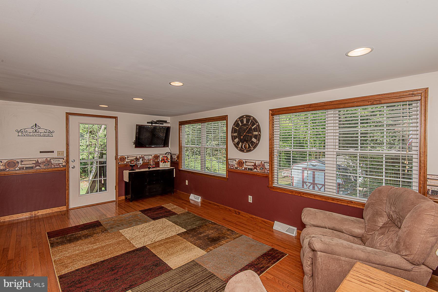 8309 Risha Drive Severn, MD 21144 - Photo 19 of 34 Family room with exit to exterior oasis