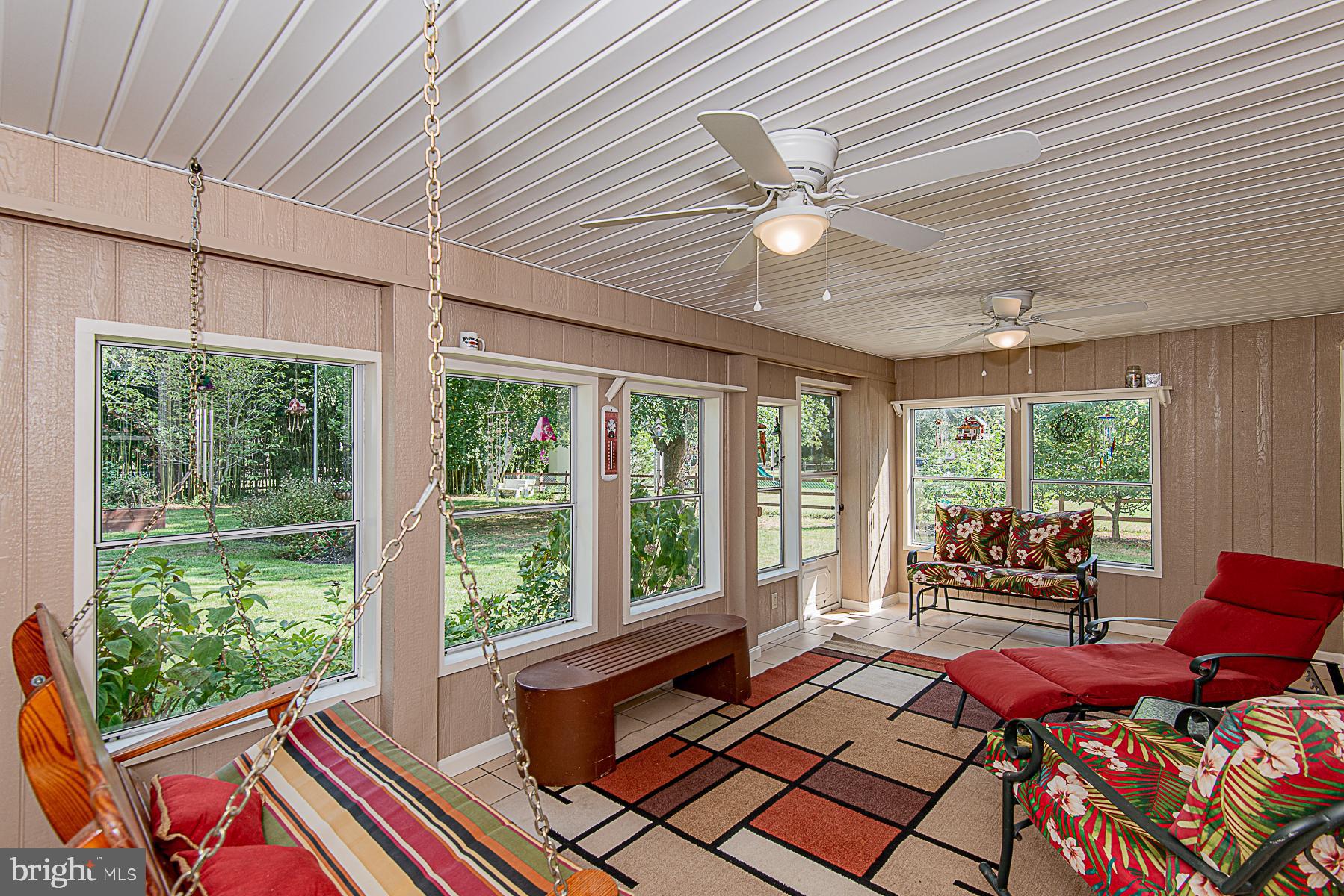 8309 Risha Drive Severn, MD 21144 - Photo 33 of 34 Enclosed sun porch on rear of home