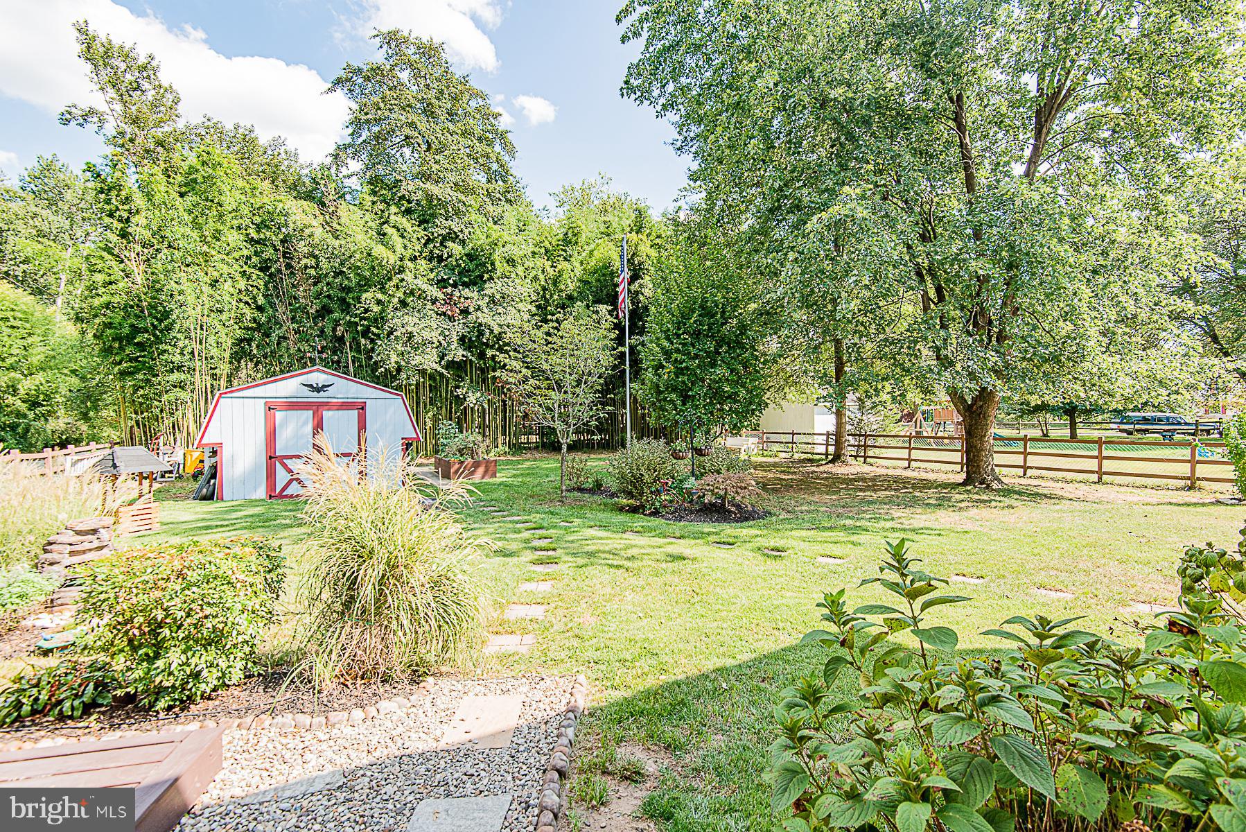 8309 Risha Drive Severn, MD 21144 - Photo 6 of 34 Beautiful fenced back yard retreat with fire pit