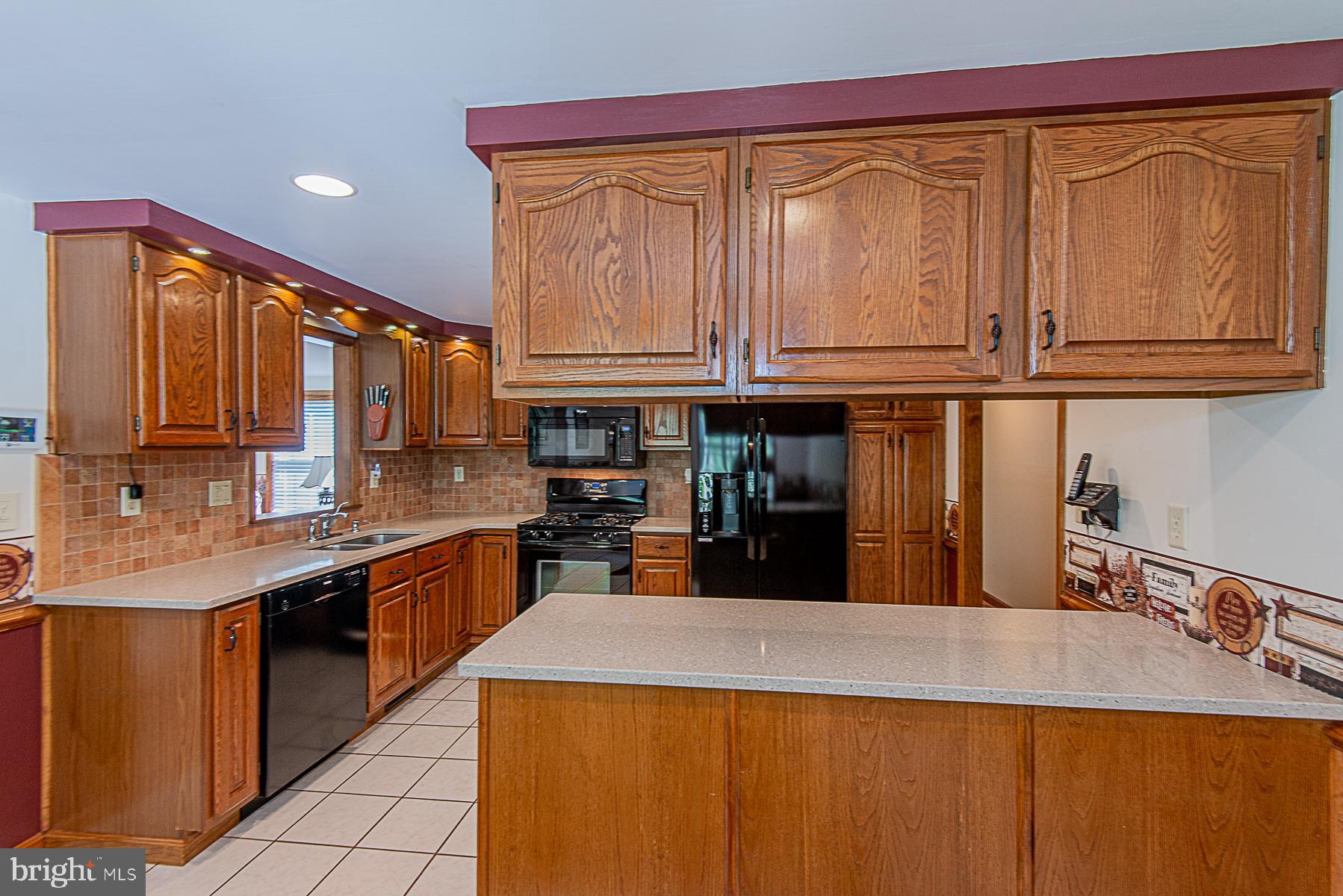 8309 Risha Drive Severn, MD 21144 - Photo 9 of 34 Gorgeous kitchen with Silestone countertops