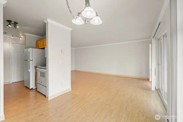 a view of a room with a kitchen