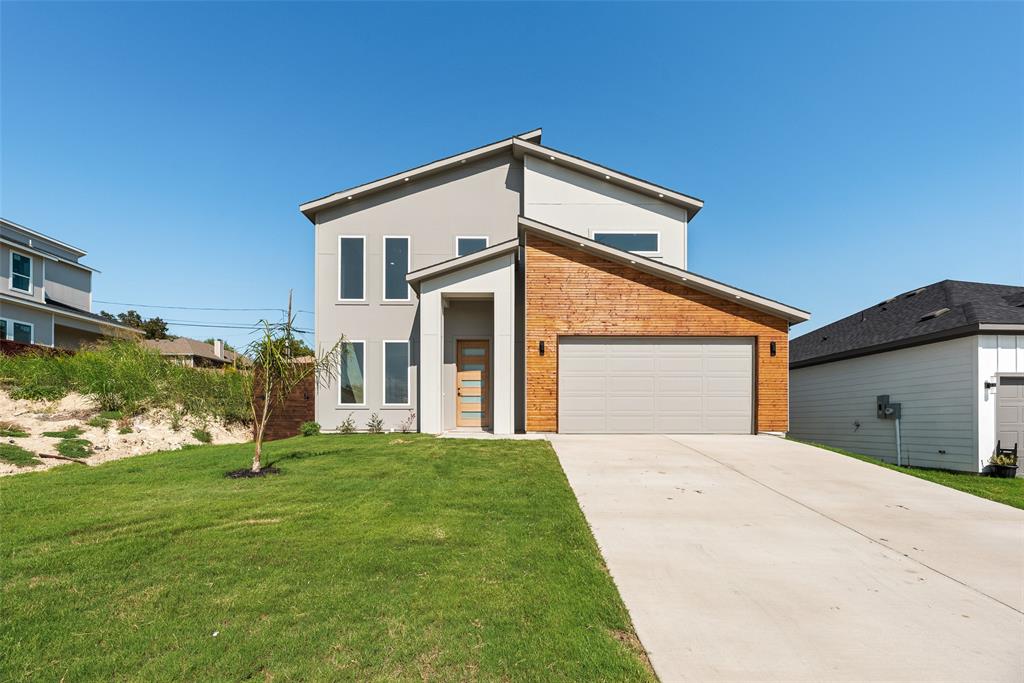 6046 Plum Dale Road Dallas, TX 75241 - Photo 1 of 27 a backyard of a house with barbeque oven and plants