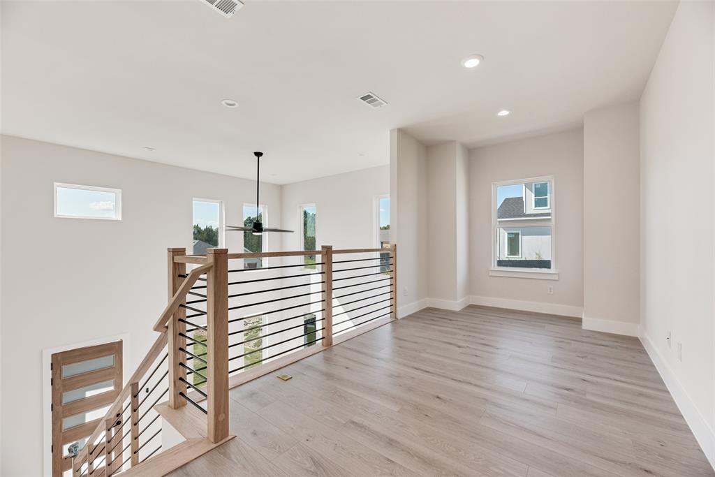 6046 Plum Dale Road Dallas, TX 75241 - Photo 17 of 27 a view of entryway and hall with wooden floor