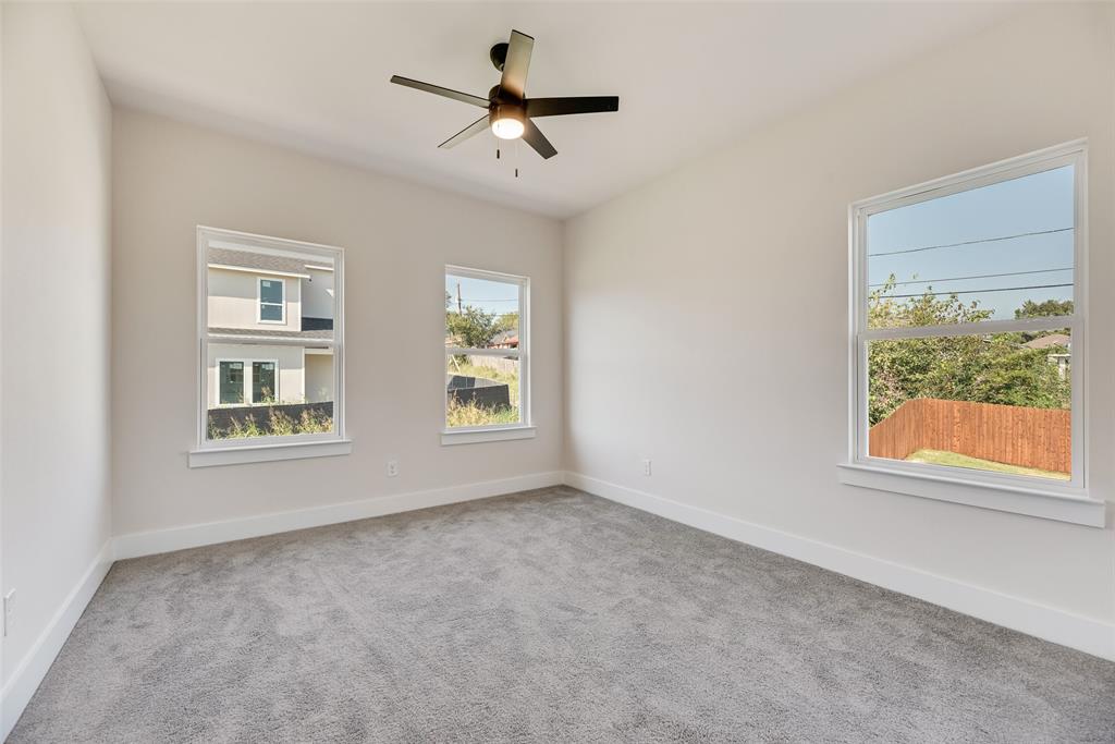 6046 Plum Dale Road Dallas, TX 75241 - Photo 19 of 27 a view of empty room with windows