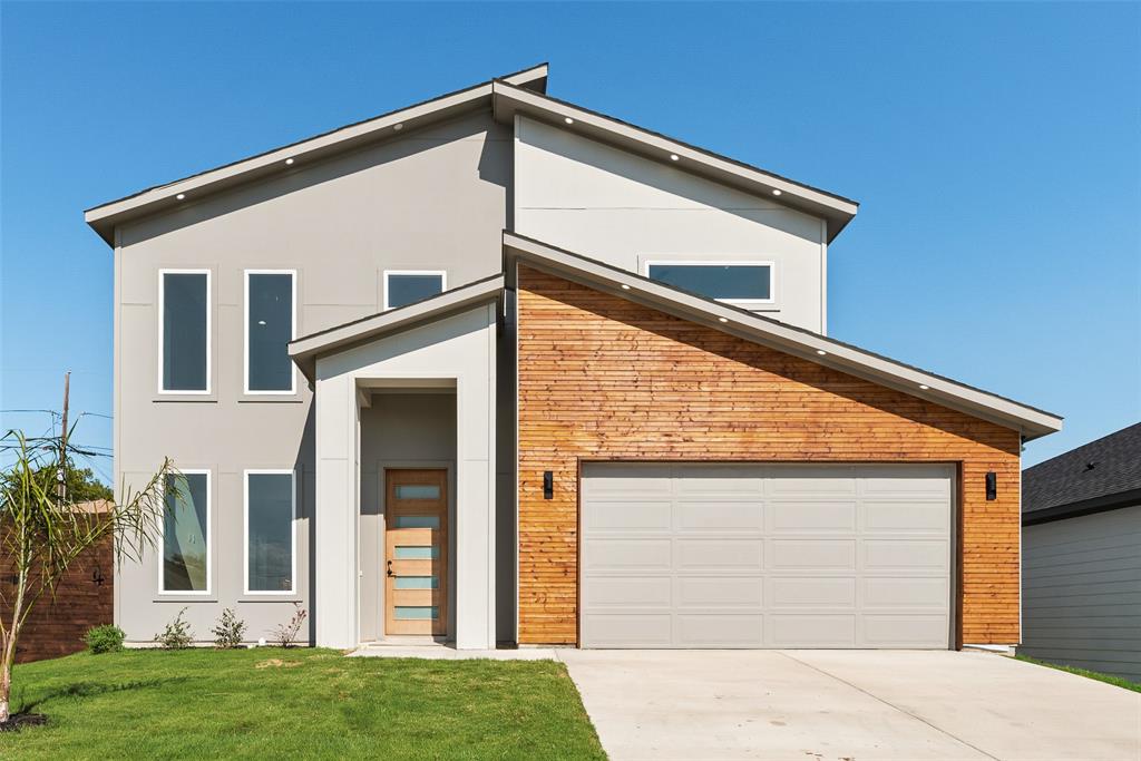 6046 Plum Dale Road Dallas, TX 75241 - Photo 2 of 27 a front view of a house with a yard