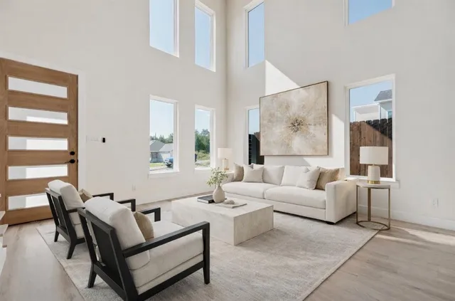 a living room with furniture and a large window