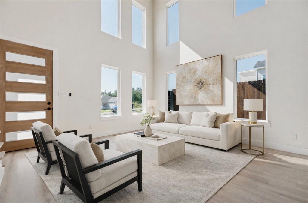 6046 Plum Dale Road Dallas, TX 75241 - Photo 4 of 27 a living room with furniture and a large window