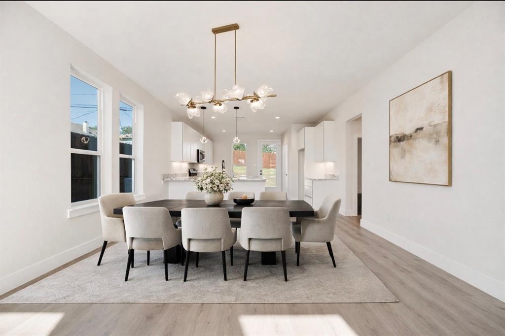 6046 Plum Dale Road Dallas, TX 75241 - Photo 9 of 27 a view of a dining room with furniture and chandelier