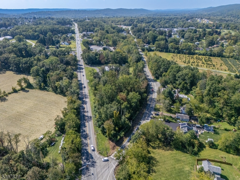 283 Highway 31 Washington, NJ 07882 - Photo 11 of 11 an aerial view of a houses with a lush green hillside
