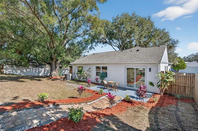 a view of a backyard with a patio