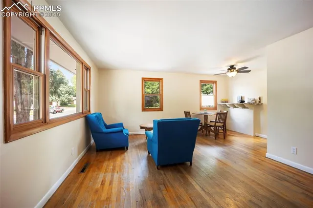 a living room with furniture and a window