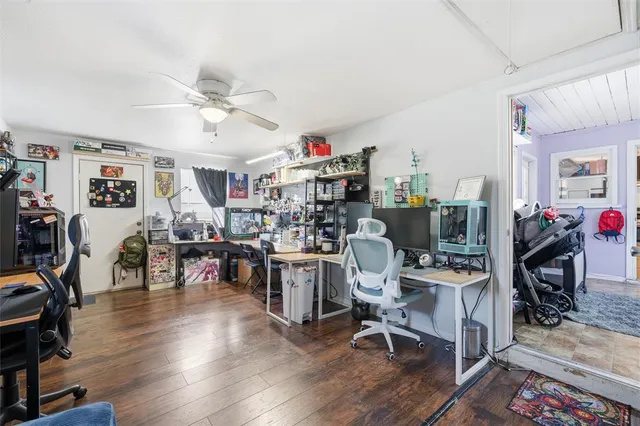 a view of a workspace with furniture and a living room
