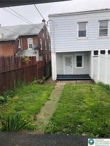 a house view with a garden space