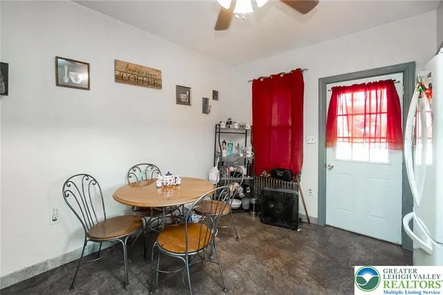 a view of a room with furniture and window