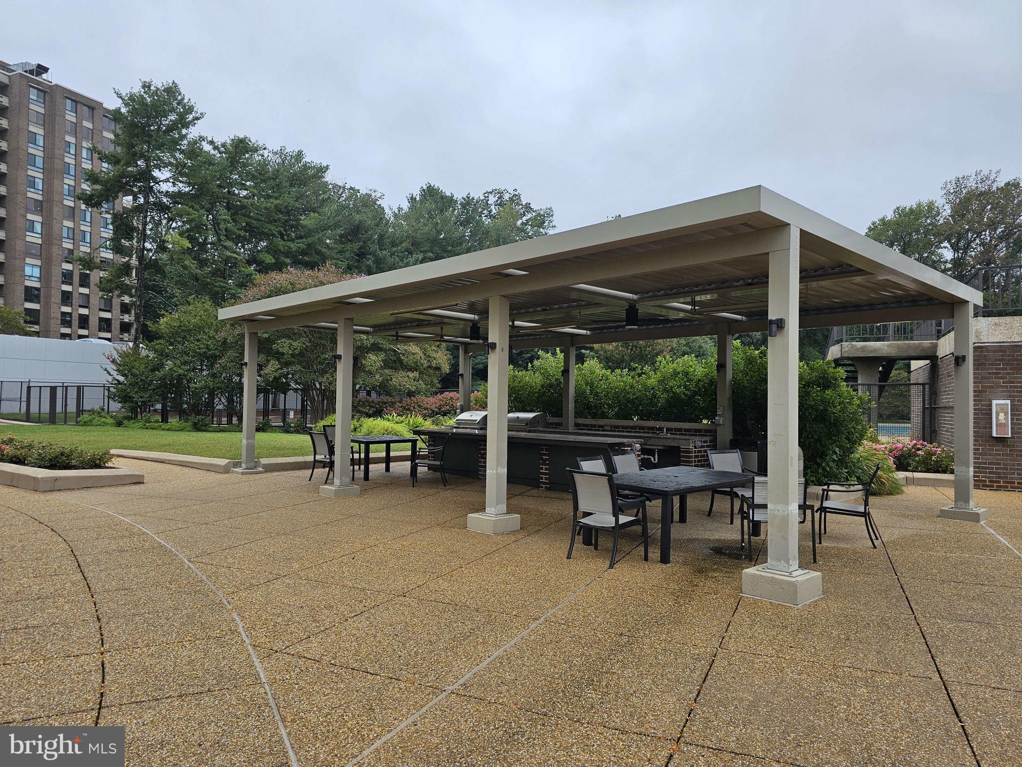 1800 Old Meadow Road, Unit 621 McLean, VA 22102 - Photo 25 of 28 a view of a sitting area with furniture and garden