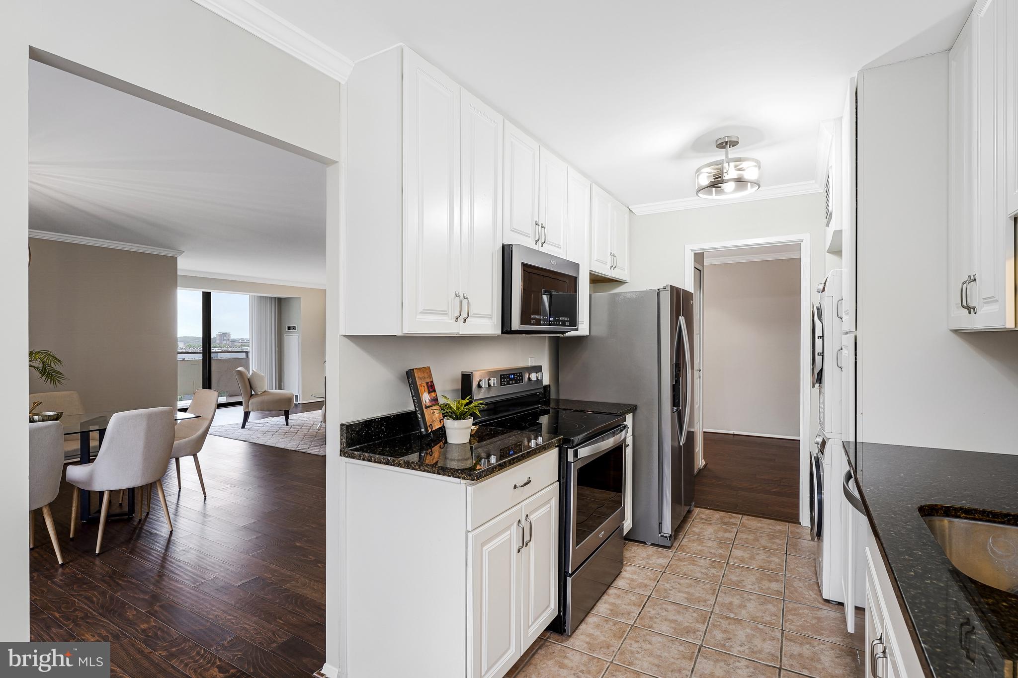 1800 Old Meadow Road, Unit 621 McLean, VA 22102 - Photo 7 of 28 a kitchen with a refrigerator stove and microwave