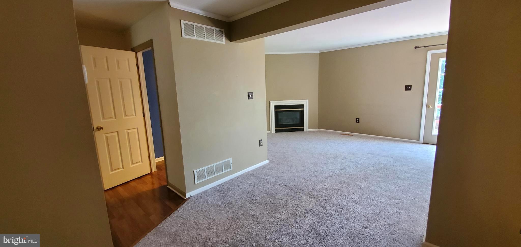 2927 Newport Way Sinking Spring, PA 19608 - Photo 8 of 24 living room fireplace and half bath entrance