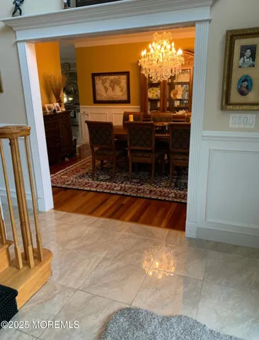 a view of a livingroom with wooden floor and a fireplace
