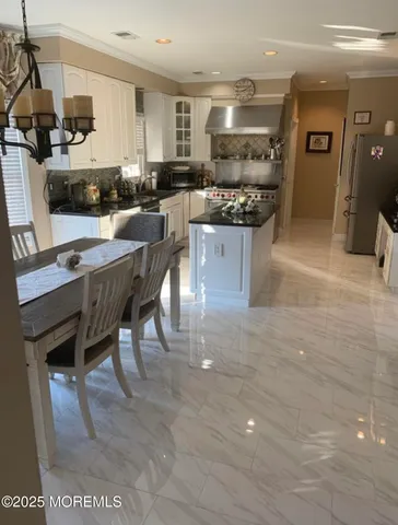 a bathroom with a tub a sink and a window