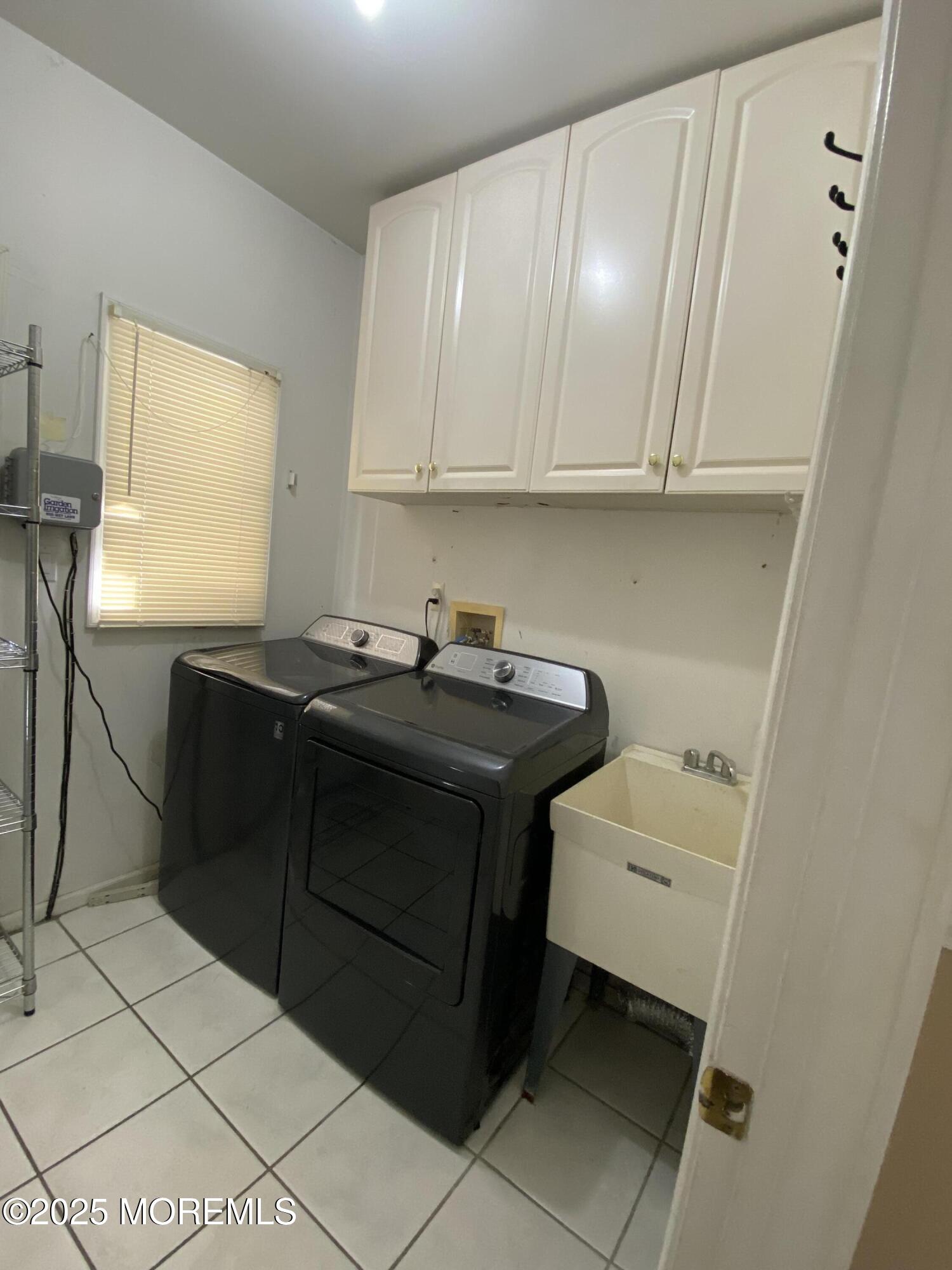 41 Church Road Howell, NJ 07731 - Photo 42 of 69 a utility room with sink dryer and washer