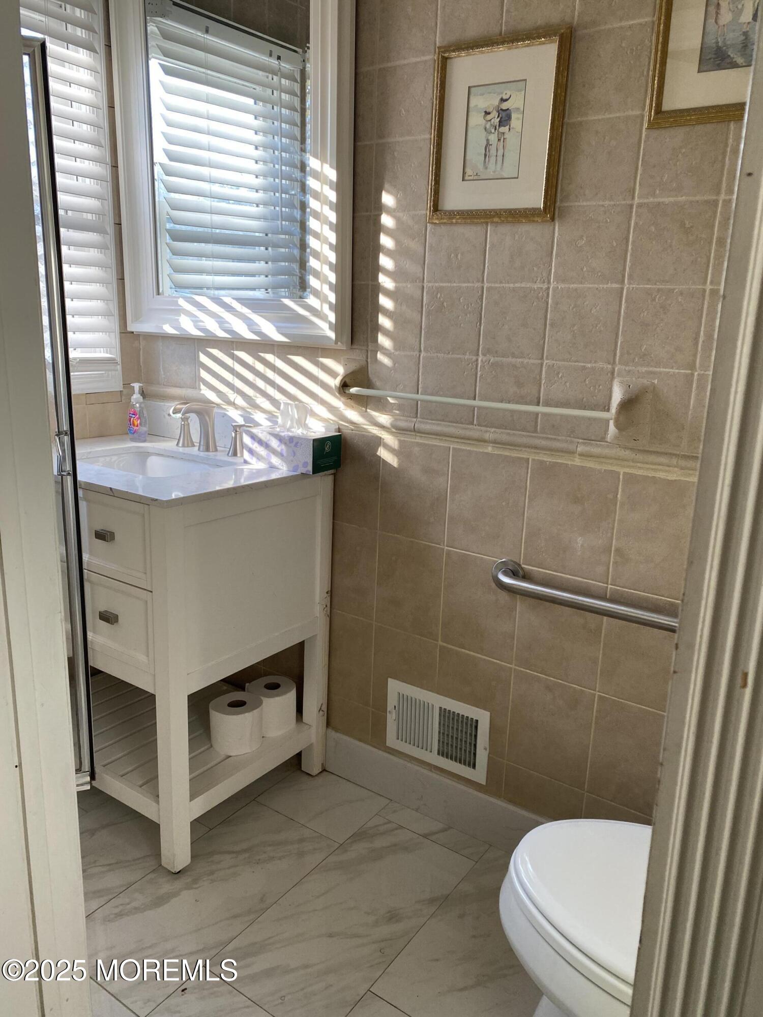 41 Church Road Howell, NJ 07731 - Photo 43 of 69 a bathroom with a sink a toilet and shower