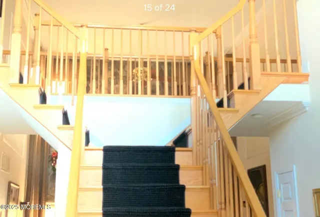 a view of a living room with furniture and a fireplace