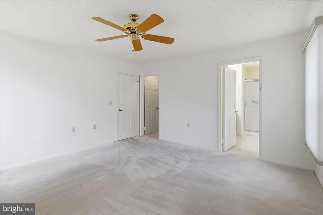 a bathroom with a double vanity sink mirror and shower