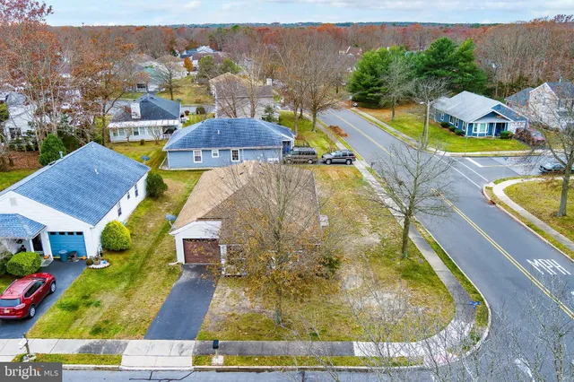 an aerial view of a house with swimming pool