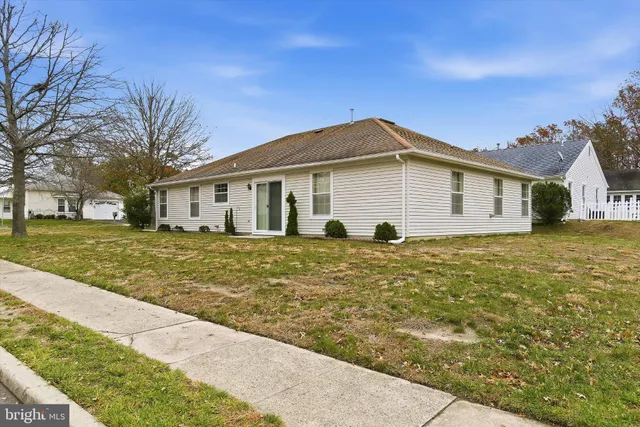 an aerial view of a house with a swimming pool