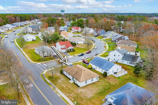 an aerial view of a house with a ocean view