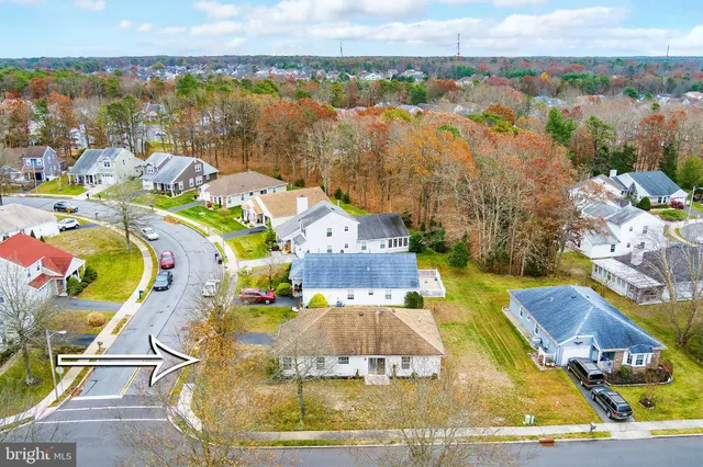 a sign that is sitting in front of flowers