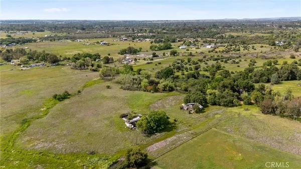 a view of a field with an ocean view