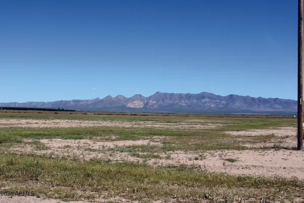 a view of an ocean and a mountain